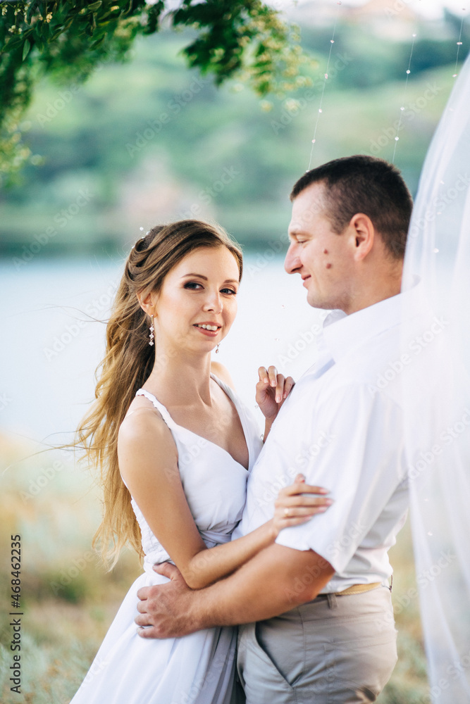 Obraz premium young couple a girl and a guy are walking in the field