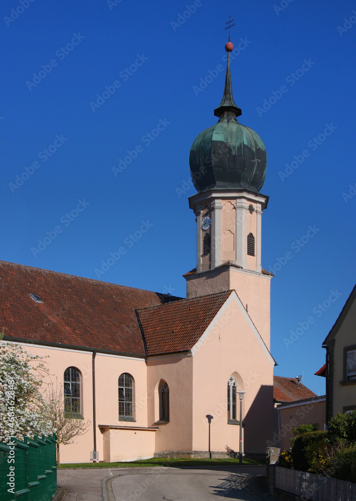 Baroque village church of St Nikolaus with its onion dome tower and its gothic side chapel in Burgoberbach, Franken region in Germany