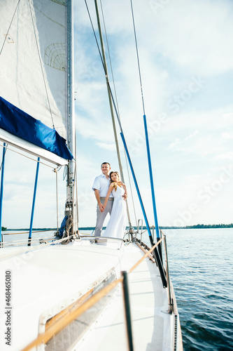 young couple guy and girl on a sailing yacht © omelnickiy