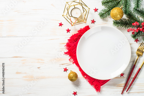 Christmas table setting with holiday decorations at white wooden table. Top viewwith copy space. photo