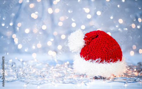 santa claus hat on christmas light background