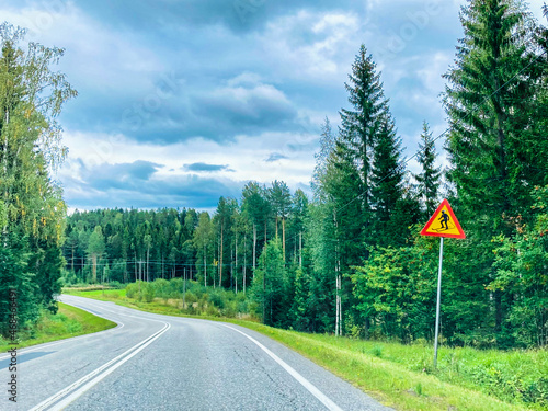 Road to the forest in finland in cloudy weather
