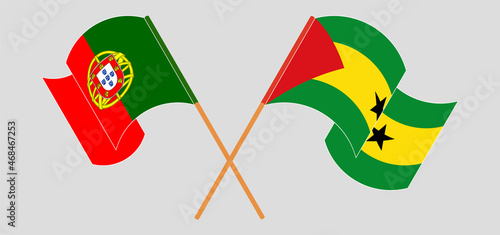 Crossed and waving flags of Portugal and Sao Tome and Principe
