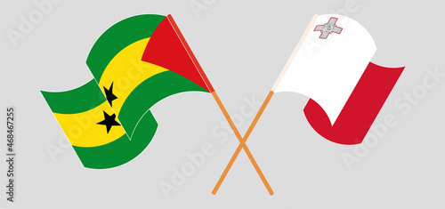 Crossed and waving flags of Sao Tome and Principe and Malta