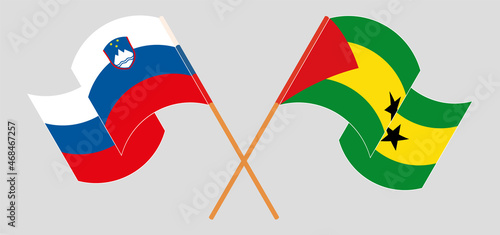 Crossed and waving flags of Slovenia and Sao Tome and Principe