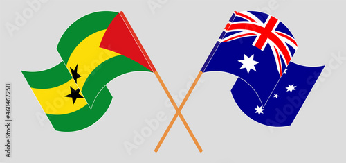 Crossed and waving flags of Sao Tome and Principe and Australia