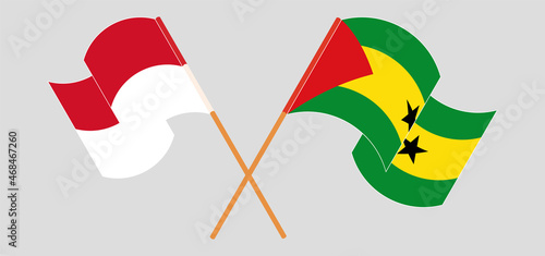Crossed and waving flags of Indonesia and Sao Tome and Principe