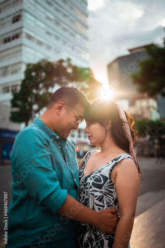 beautiful couple hugging during sunset