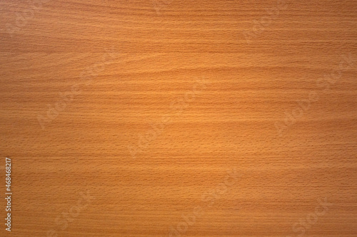 The texture of the wooden countertop is yellow with horizontal stripes of dark color. Wooden background for text.