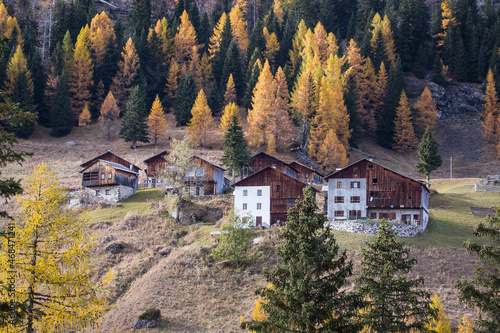 Typical old and ancient farming house architecture from the italian Dolomites during autumn