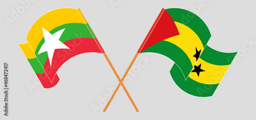 Crossed and waving flags of Myanmar and Sao Tome and Principe