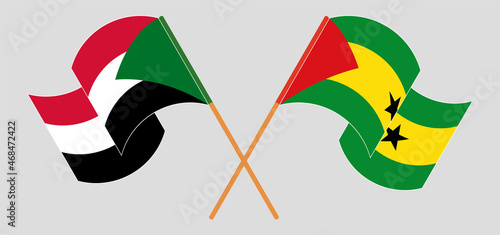 Crossed and waving flags of the Sudan and Sao Tome and Principe