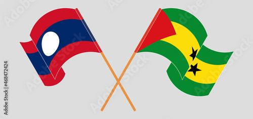 Crossed and waving flags of Laos and Sao Tome and Principe