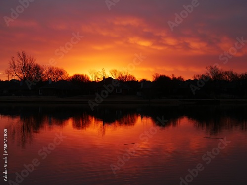 Sunset skies reflected in the lake on a winter day