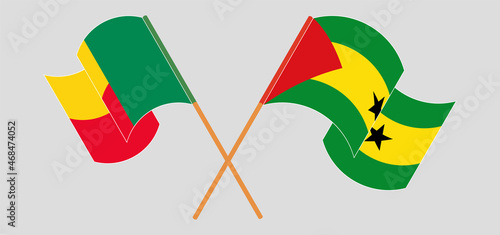 Crossed and waving flags of Benin and Sao Tome and Principe