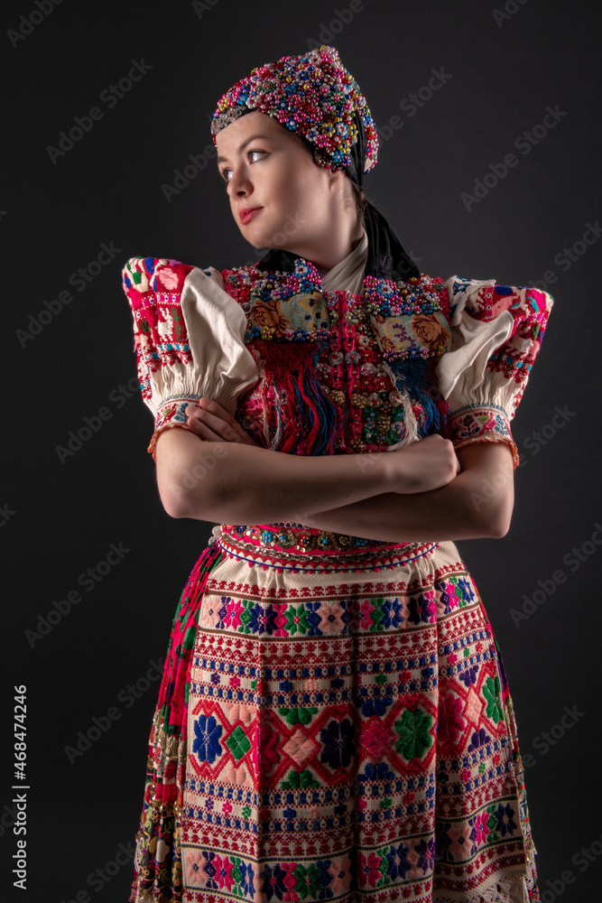 Young beautiful slovak woman in traditional dress. Slovak folklore