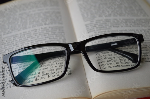 glasses on the book