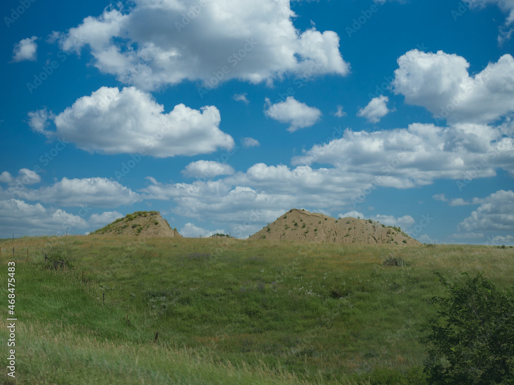 Scenic landscape with rolling hills and beautiful clouds in Nebraska, USA.