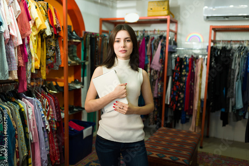 Beautiful saleswoman at the fashion boutique © AntonioDiaz