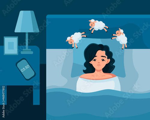 A young girl is lying in bed with her eyes open and can't fall asleep