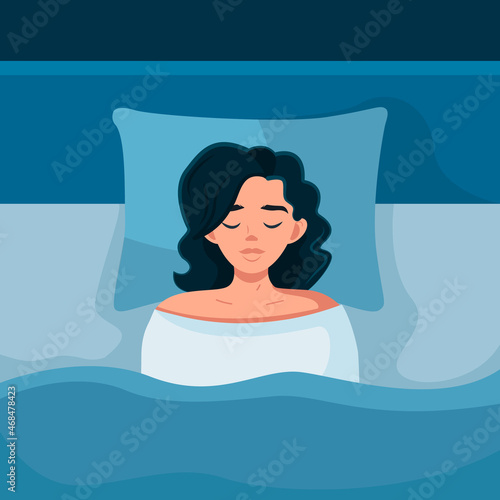 A young woman is sleeping in her bed. Healthy sleep