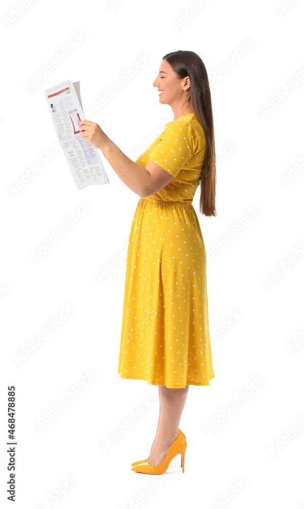 Beautiful woman in yellow dress reading newspaper on white background Beautiful woman in yellow dress reading newspaper on white background