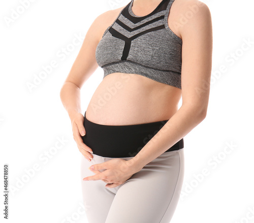 Sporty young pregnant woman...