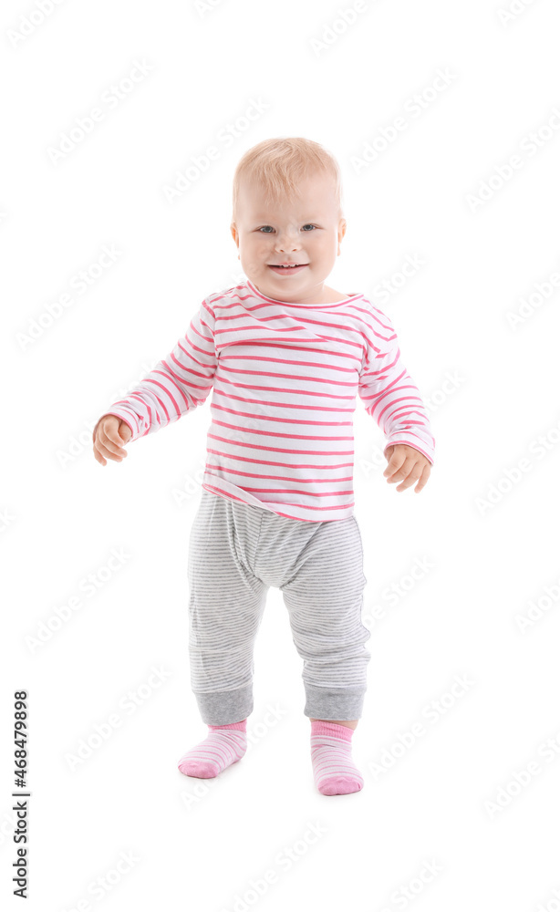 Cute baby girl learning to walk on white background Cute baby girl learning to walk on white background