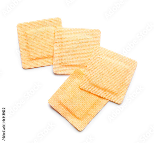 Square medical plasters on white background