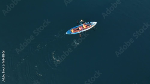 Wallpaper Mural Top view of a family kayaking in blue sea. Woman, man and children.  Torontodigital.ca