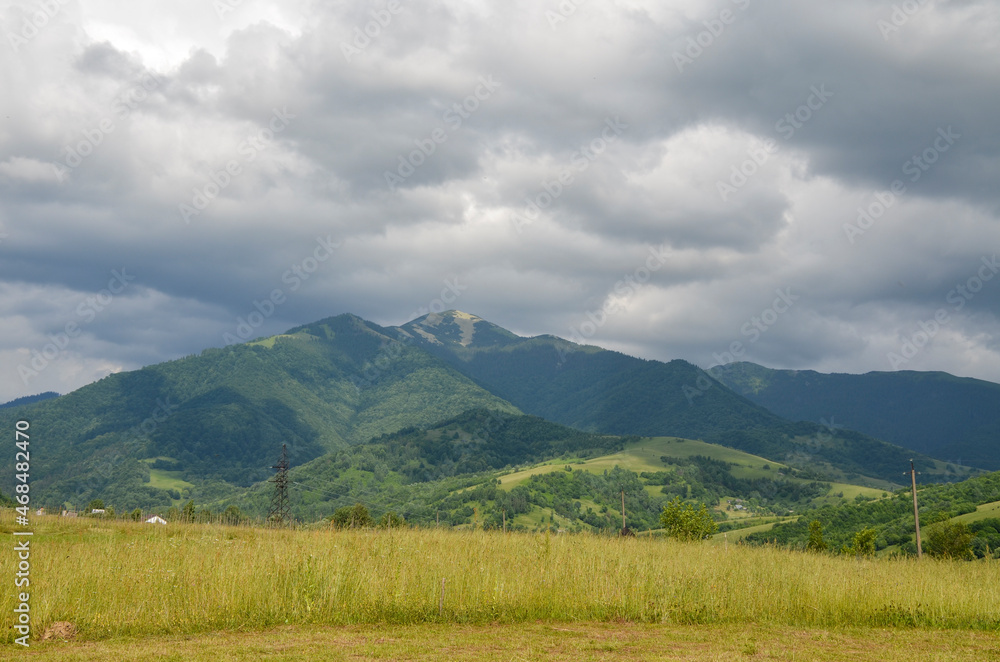 Fototapeta premium Panoramic view of picturesque Carpathian Mountains landscape with sharp peak of Mount Strymba. Holidays in the mountains.