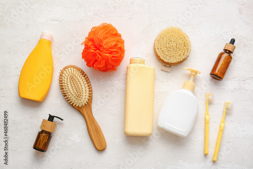 Set of bath supplies and cosmetics on light background