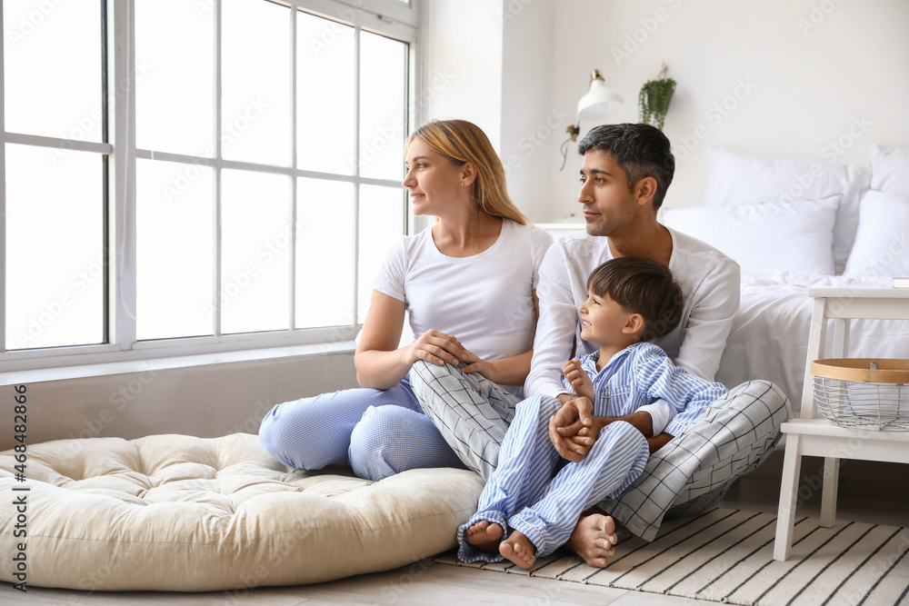 Little boy with his parents in bedroom Little boy with his parents in bedroom