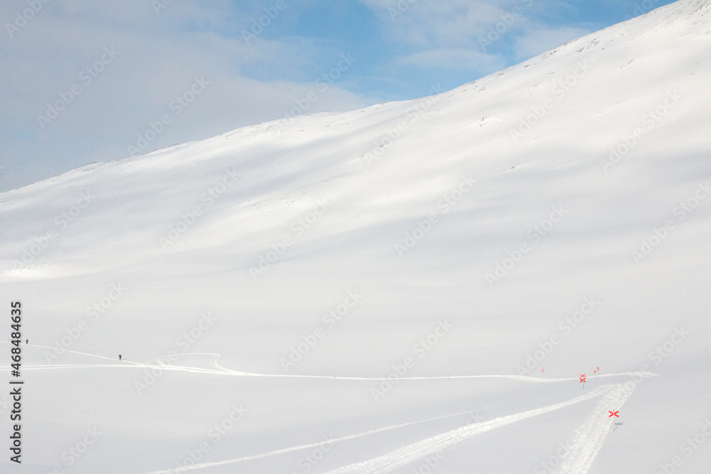 Tiny skiers on their way to Tjaktja pass, Kungsleden trail between Abisko and Nikkaluokta, April 2021 Tiny skiers on their way to Tjaktja pass, Kungsleden trail between Abisko and Nikkaluokta, April 2021