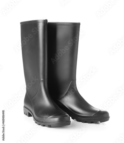 Pair of black rubber boots on white background