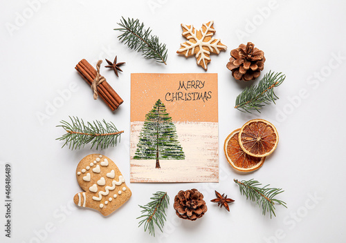 Greeting card with text MERRY CHRISTMAS, fir tree branches, food and pine cones on white background