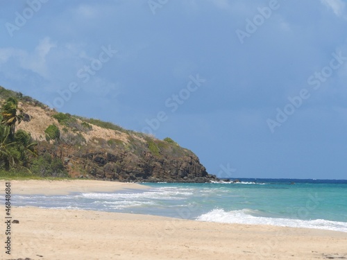 Waves rolling into a white sand Zoni beach in Culebra  Puerto Rico