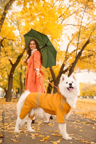 Young woman with umbrella a...