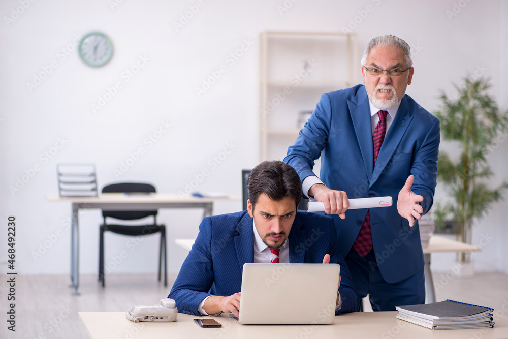 Two male colleagues working in the office Two male colleagues working in the office