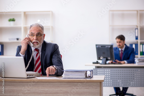 Two male colleagues working in the office