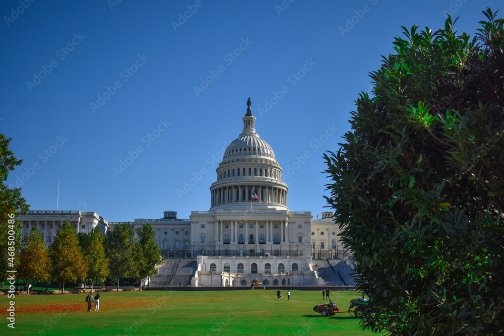 Washington, DC, USA - November 1, 2021: Front of the U.S. Capitol Building Viewed from the West, Framed by Trees on a Bright Sunny Day