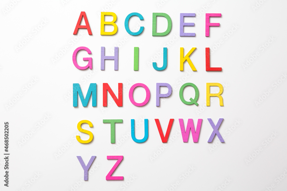 Colorful wooden english letters A-Z on white background
