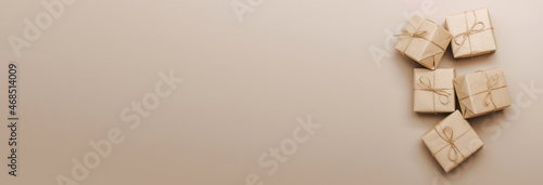 Fotografi Gifts in eco-friendly paper packaging on a trendy beige background