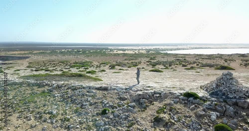 Couple Explore the Rugged Dry Australian Coastline Next to Fowlers Bay, Aerial Flyover Couple Explore the Rugged Dry Australian Coastline Next to Fowlers Bay, Aerial Flyover