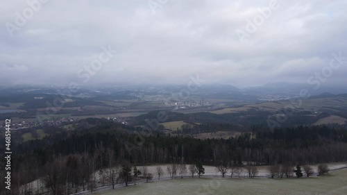 Wallpaper Mural A flight over the countryside with a path leading through the trees and a view of the surrounding thing during the beginning of the snowfall. Torontodigital.ca