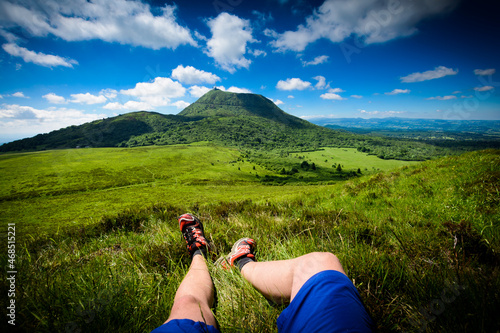 Obraz na płótnie Puy de Dome mountain and hikers legs, Auvergne w salonie