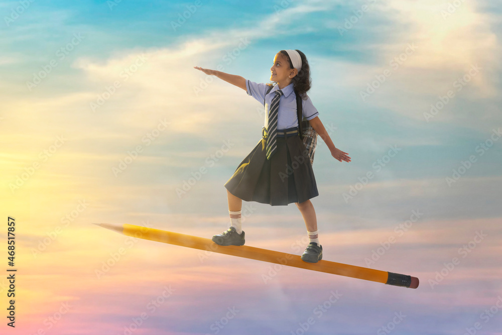 portrait of a girl in school uniform flying on pencil in the sky Stock ...