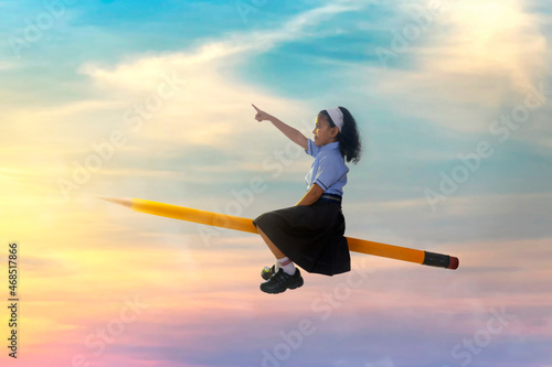 portrait of a girl pointing away while flying on pencil