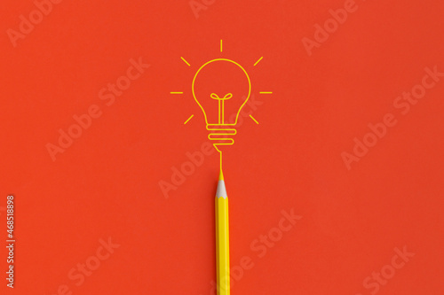 Canvas Print Light bulb on red background
