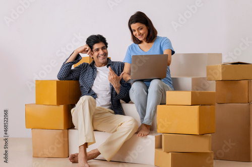 Indian middle age couple using laptop and planning for new ideas on the decoration of new room © IndiaPix